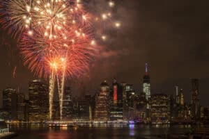 Independence Day With Fireworks in New York City. One World Trade center is in the background.