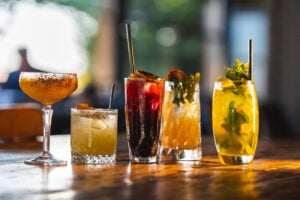 Different type of coktails on wooden table